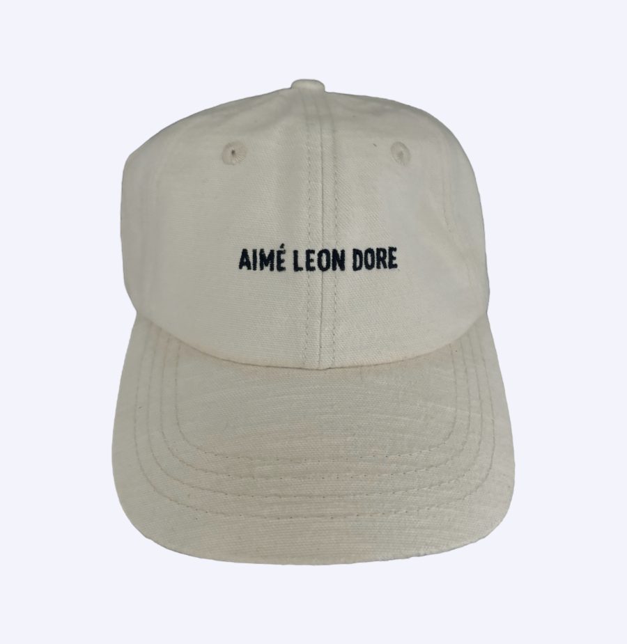 Tan snapback with a black embroidered Aime Leon Dore logo